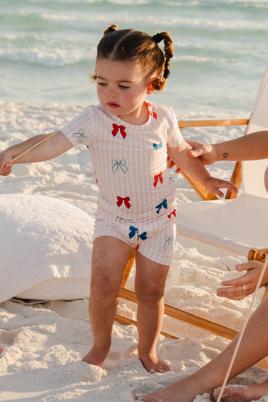 In My Jammers Liberty Bow two-piece set featuring a colorful top with bow detail and matching shorts, displayed on a mannequin.
