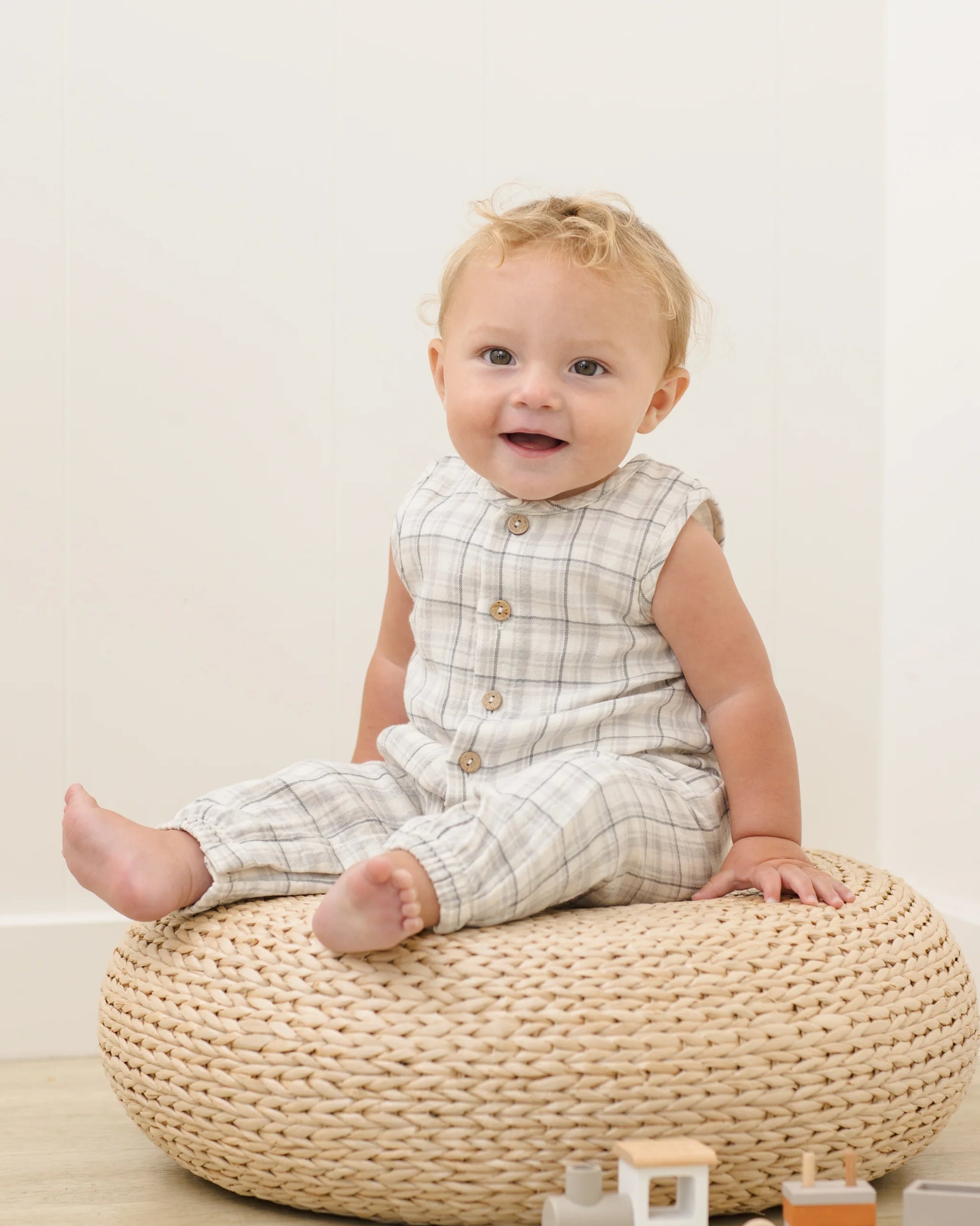 Blue plaid woven jumpsuit by Quincy Mae, featuring a relaxed fit and stylish design, shown in a lifestyle setting.
