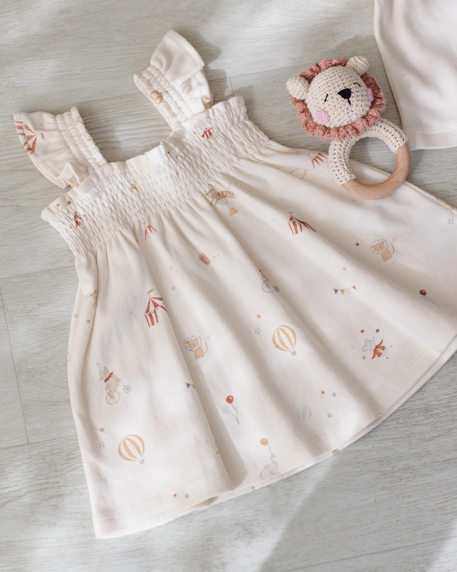 Quincy Mae Carnival Smocked Jersey Dress for girls, featuring colorful smocking and a comfortable, soft jersey fabric.