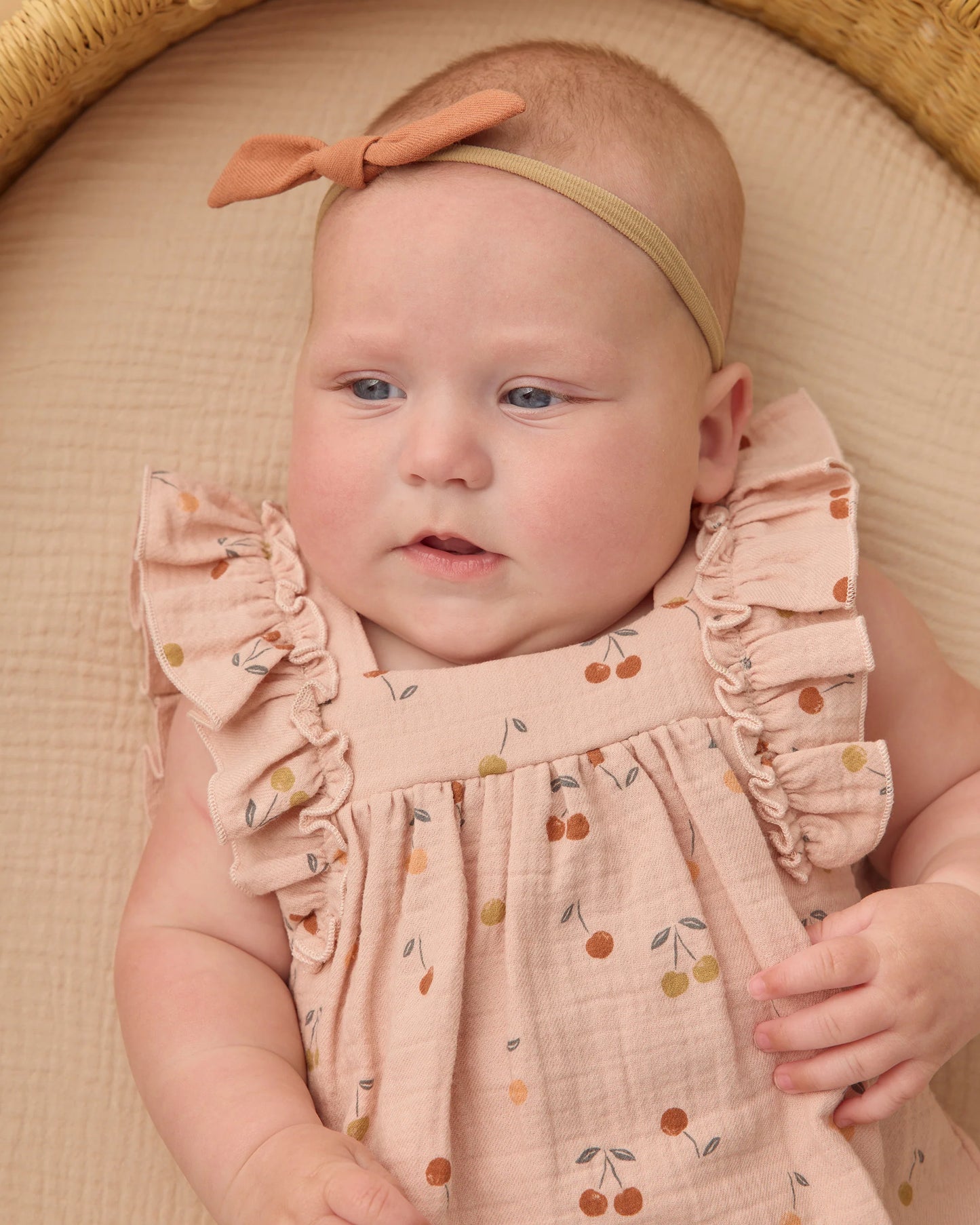 Quincy Mae Cherries Maya romper for babies, featuring a cute cherry print and soft fabric, shown on a child.