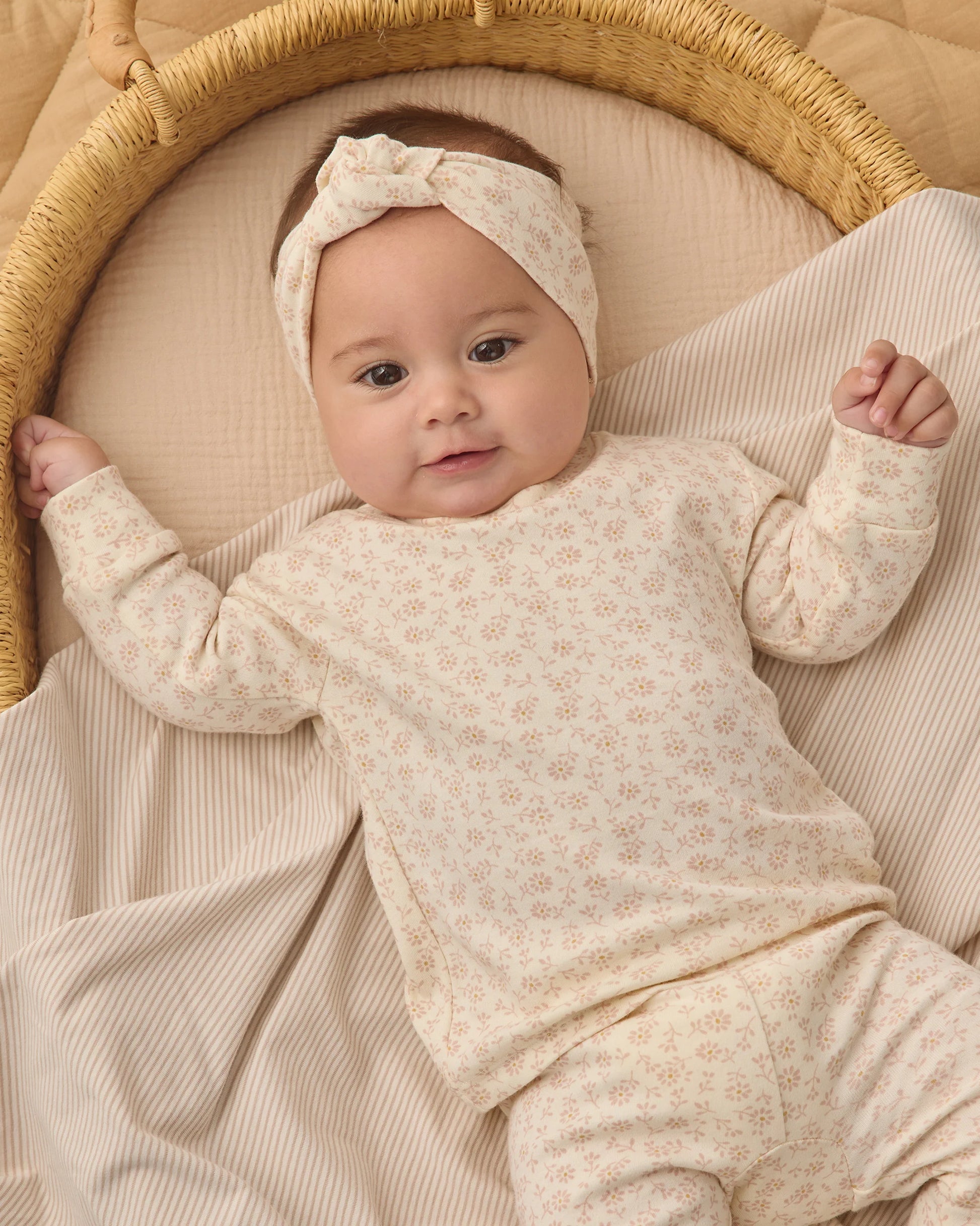 Soft Quincy Mae oat micro stripe swaddle blanket with subtle gray and white stripes, lightweight and cozy for newborns.