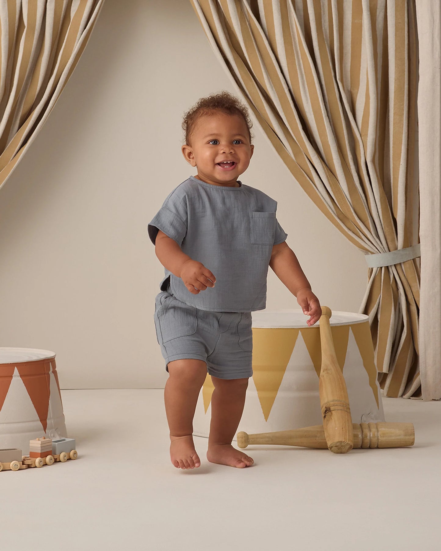 Quincy Mae Ocean Utility Short in blue fabric, showing the relaxed fit, elastic waistband, and casual style ideal for kids.