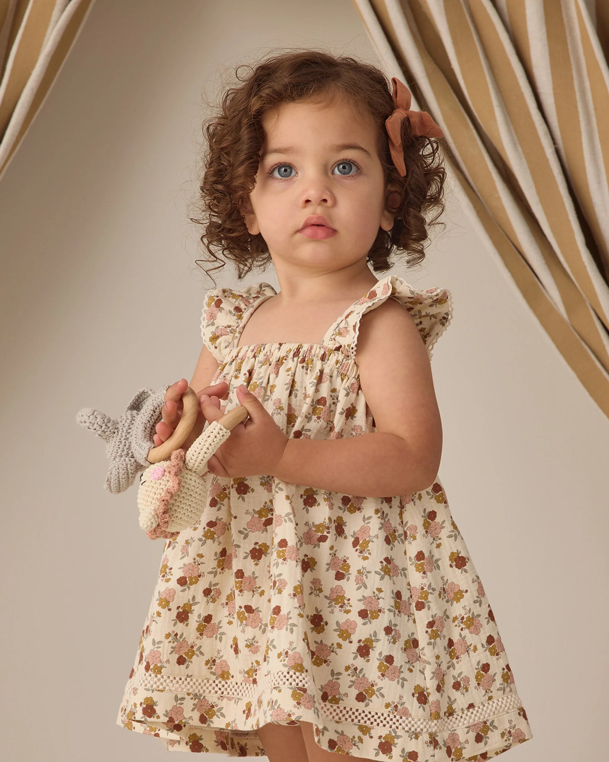Quincy Mae Bloom Ruffle Tank Dress in soft fabric with ruffle details and sleeveless design, perfect for casual or special occasions.