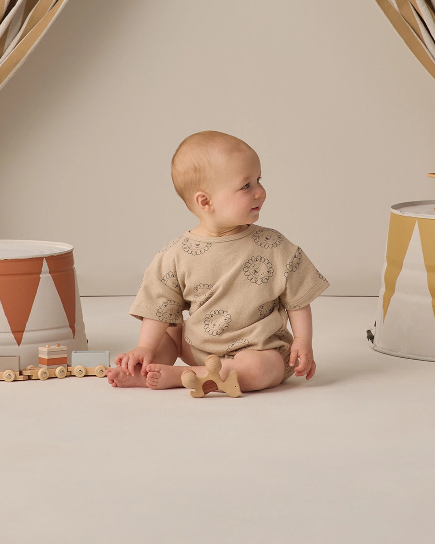 Quincy Mae lion relaxed short sleeve bubble romper for babies, featuring soft fabric and playful lion print design
