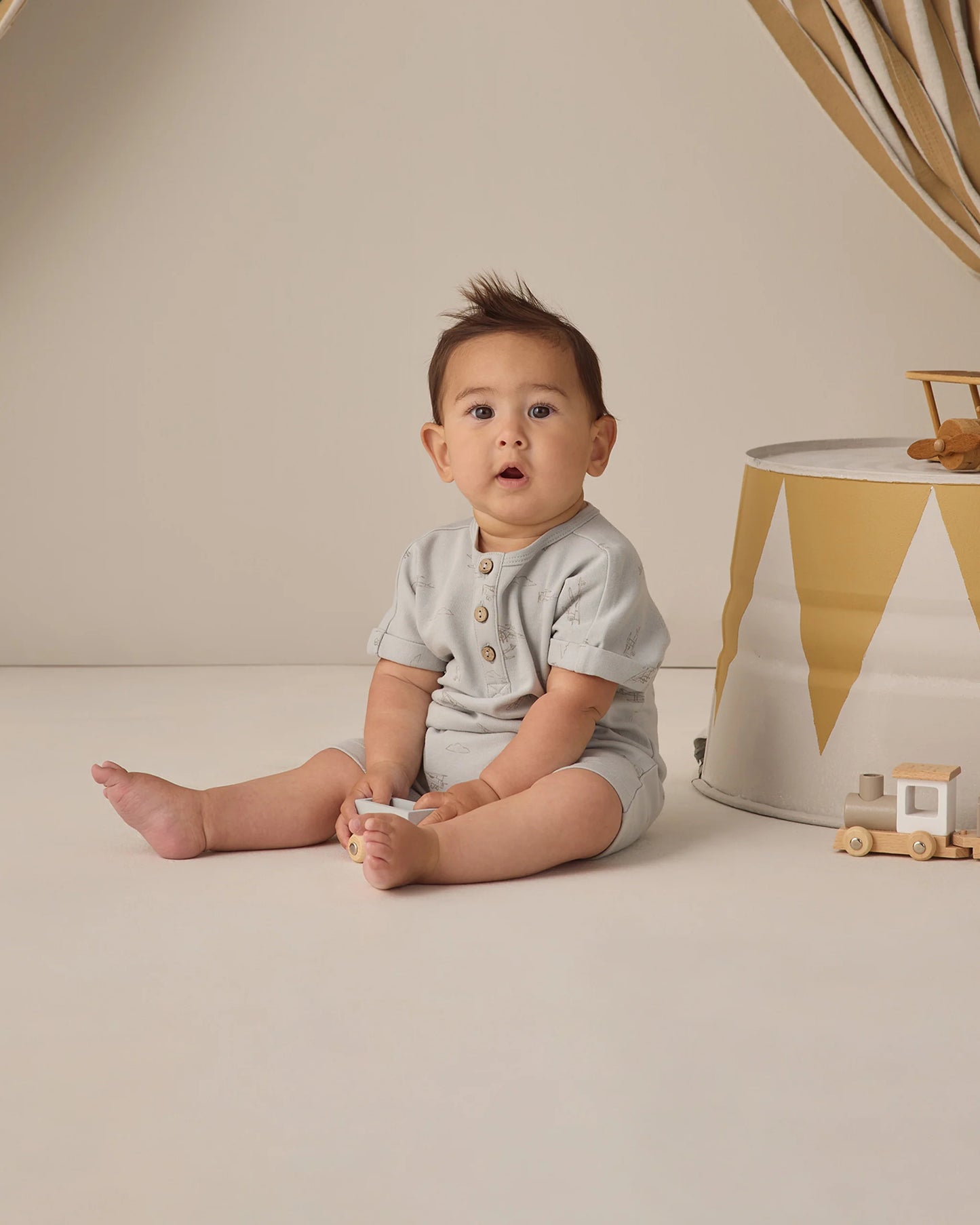 Quincy Mae airplanes short sleeve one-piece for babies, featuring a playful airplane pattern on soft fabric.