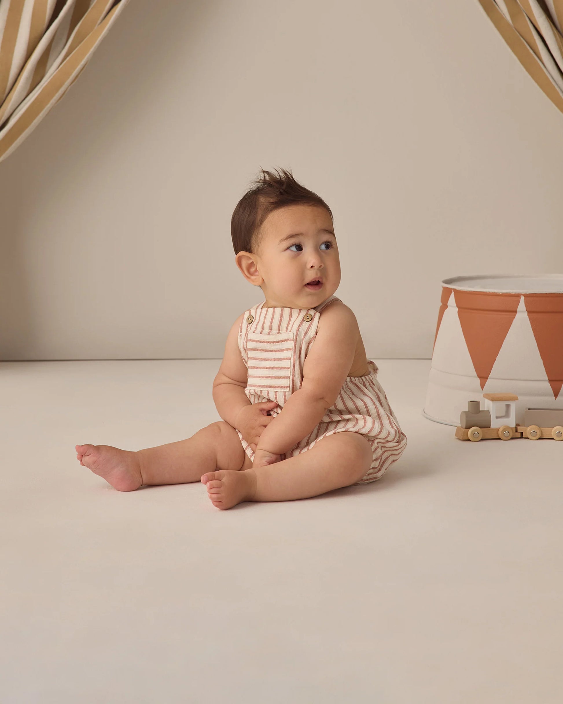 Vintage stripe Hayes romper by Quincy Mae, featuring colorful fabric and comfortable design for babies.