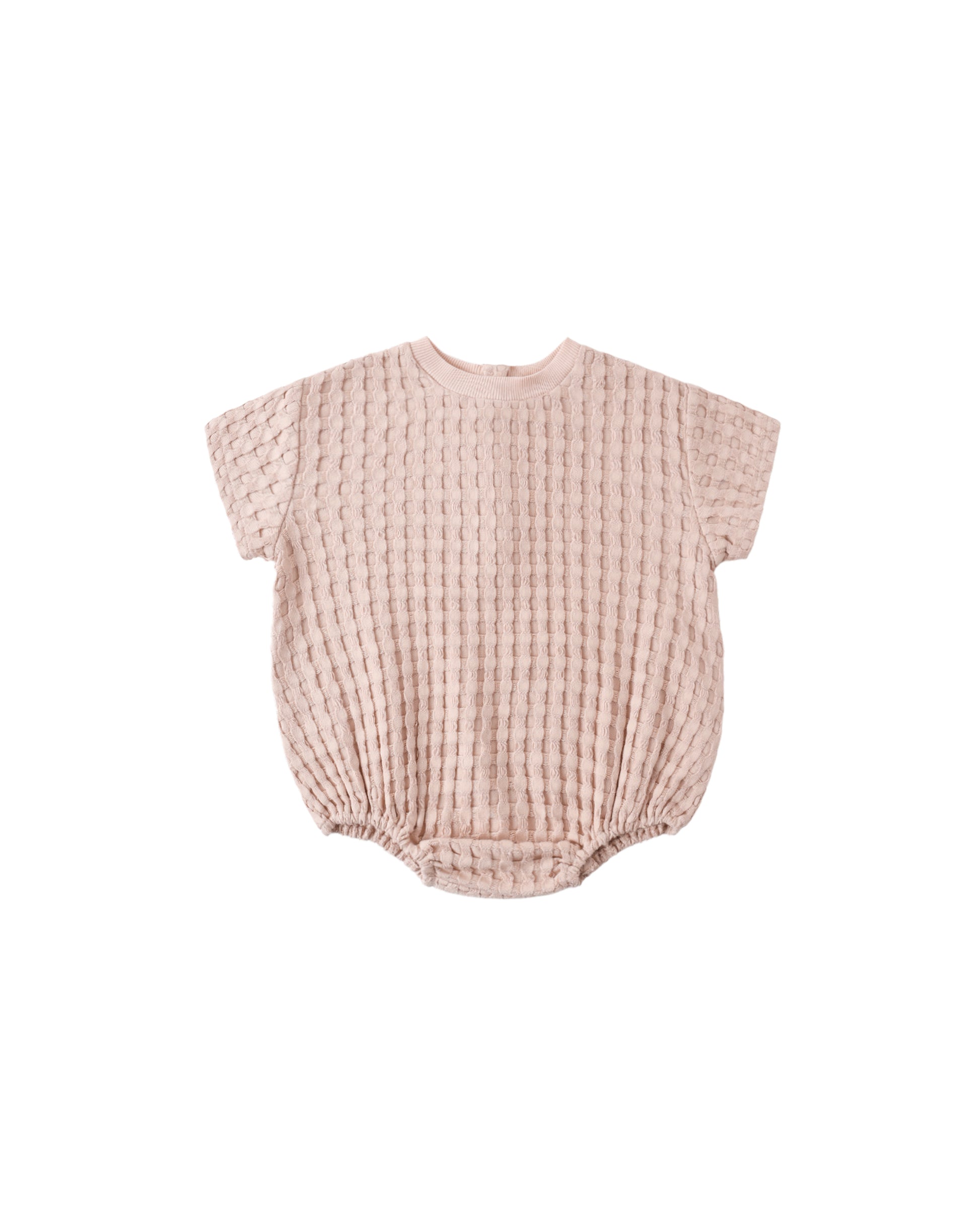 Blush Quincy Mae relaxed bubble romper for babies, featuring soft fabric and comfortable fit, shown on a flat lay.