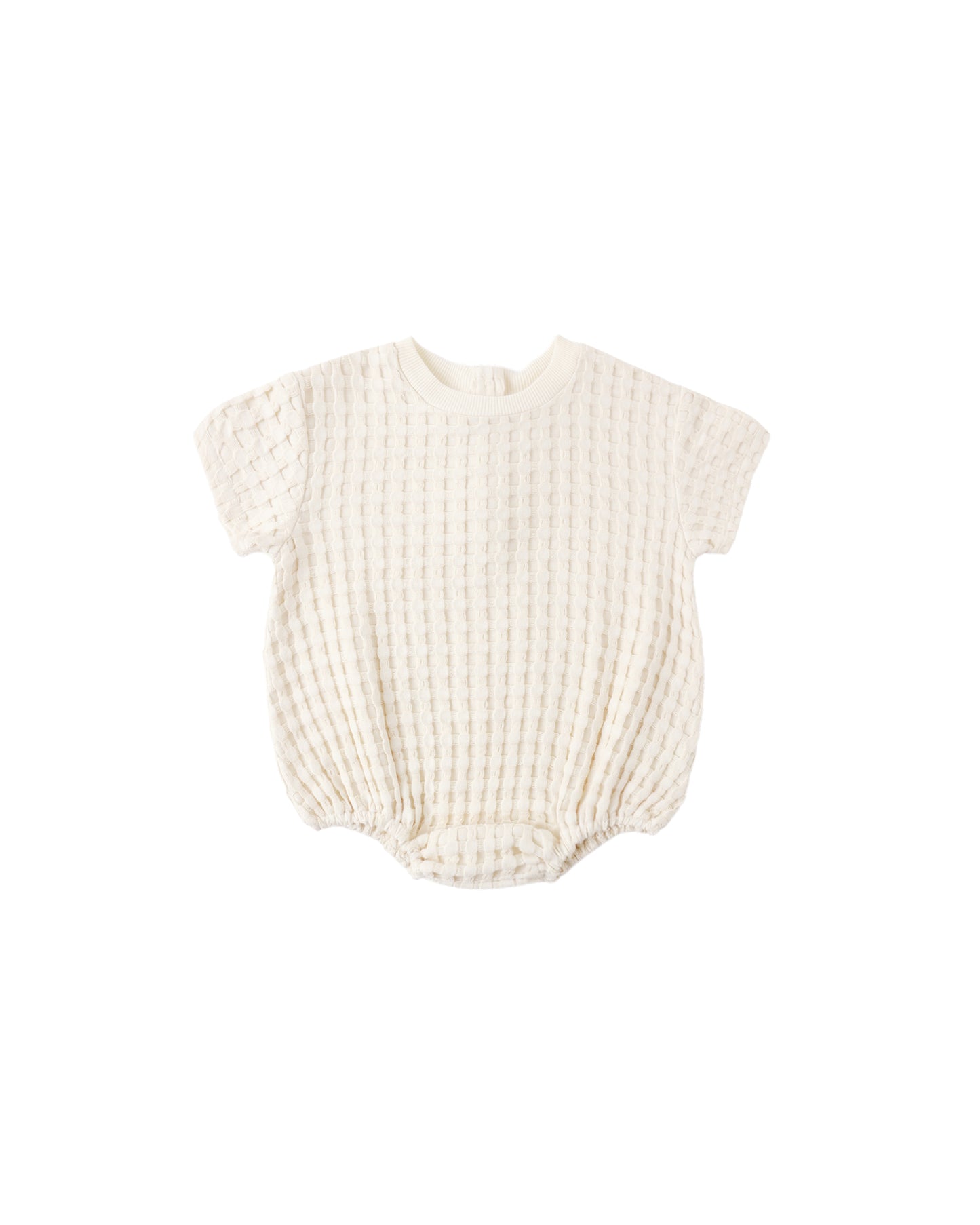 Natural relaxed bubble romper for babies by Quincy Mae, soft fabric with a comfortable, loose fit and gentle design.