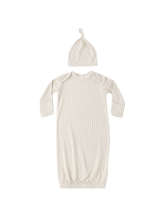 Baby girl wearing ivory gingham bamboo gown and matching hat by Quincy Mae, soft and comfortable for newborns.