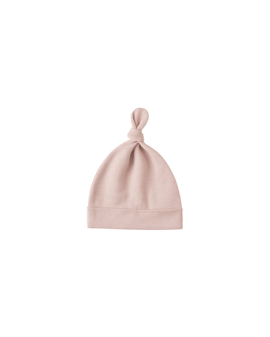 Blush knotted baby hat by Quincy Mae, soft fabric with a cute knot detail, designed for newborns and infants.