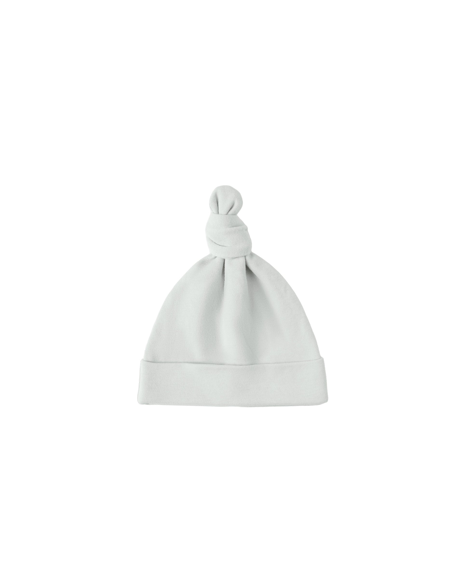 Ice blue knotted baby hat by Quincy Mae, soft accessories for infants, featuring a cozy knot design.