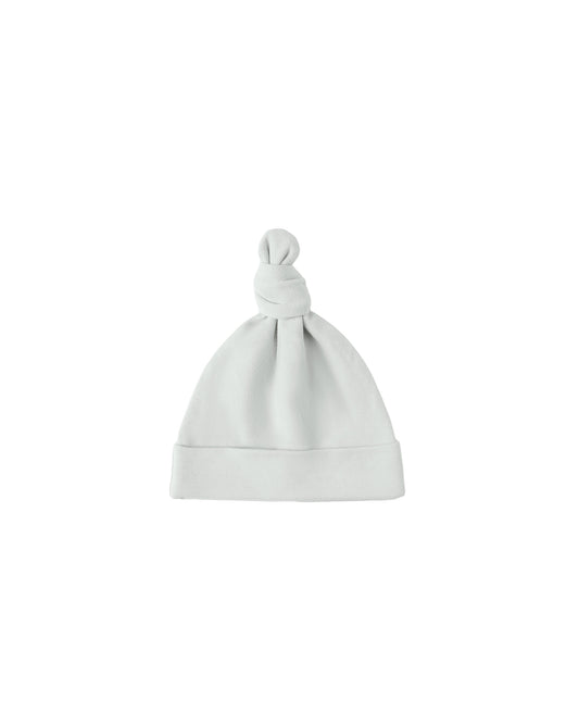 Ice blue knotted baby hat by Quincy Mae, soft accessories for infants, featuring a cozy knot design.