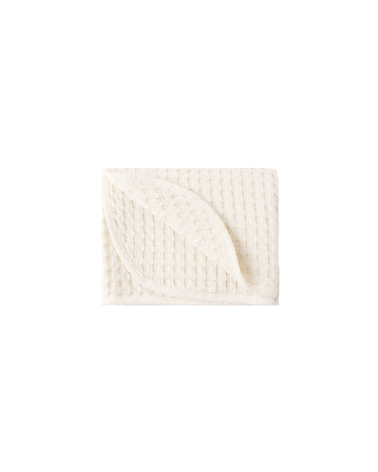 Soft natural waffle baby blanket by Quincy Mae, showing textured fabric and cozy design for infants.