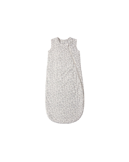 Blue floral bamboo sleep bag by Quincy Mae, featuring a soft fabric with a floral pattern and cozy design for infants.
