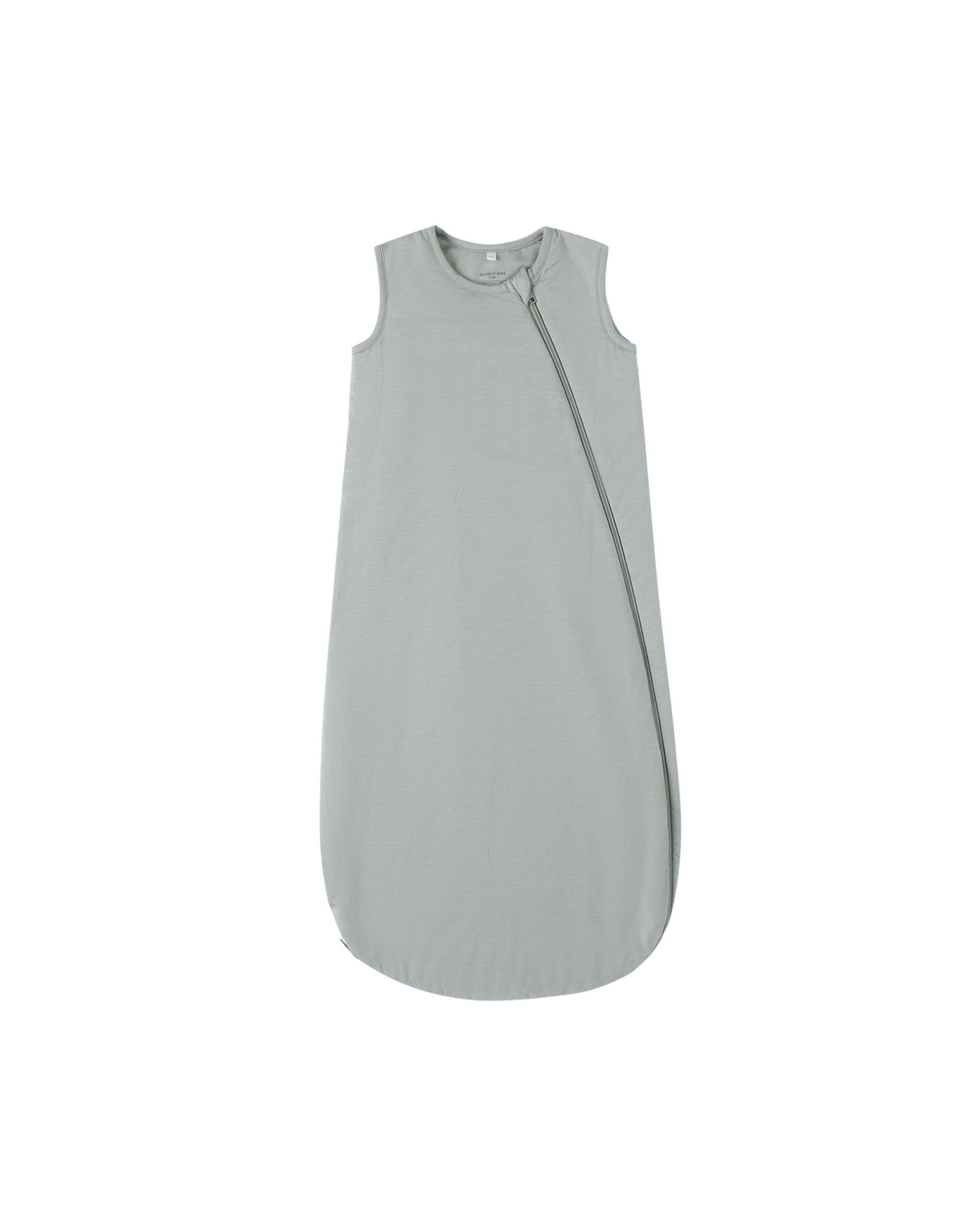 Steel blue bamboo sleep bag by Quincy Mae, soft fabric with zipper closure, designed for cozy, comfortable sleep for babies.