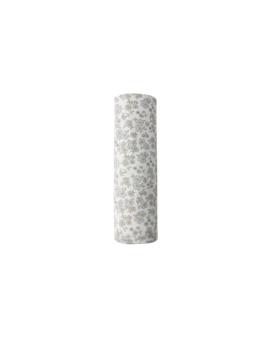 Blue floral bamboo swaddle blanket by Quincy Mae, featuring soft fabric with a delicate floral pattern and gentle blue tones.