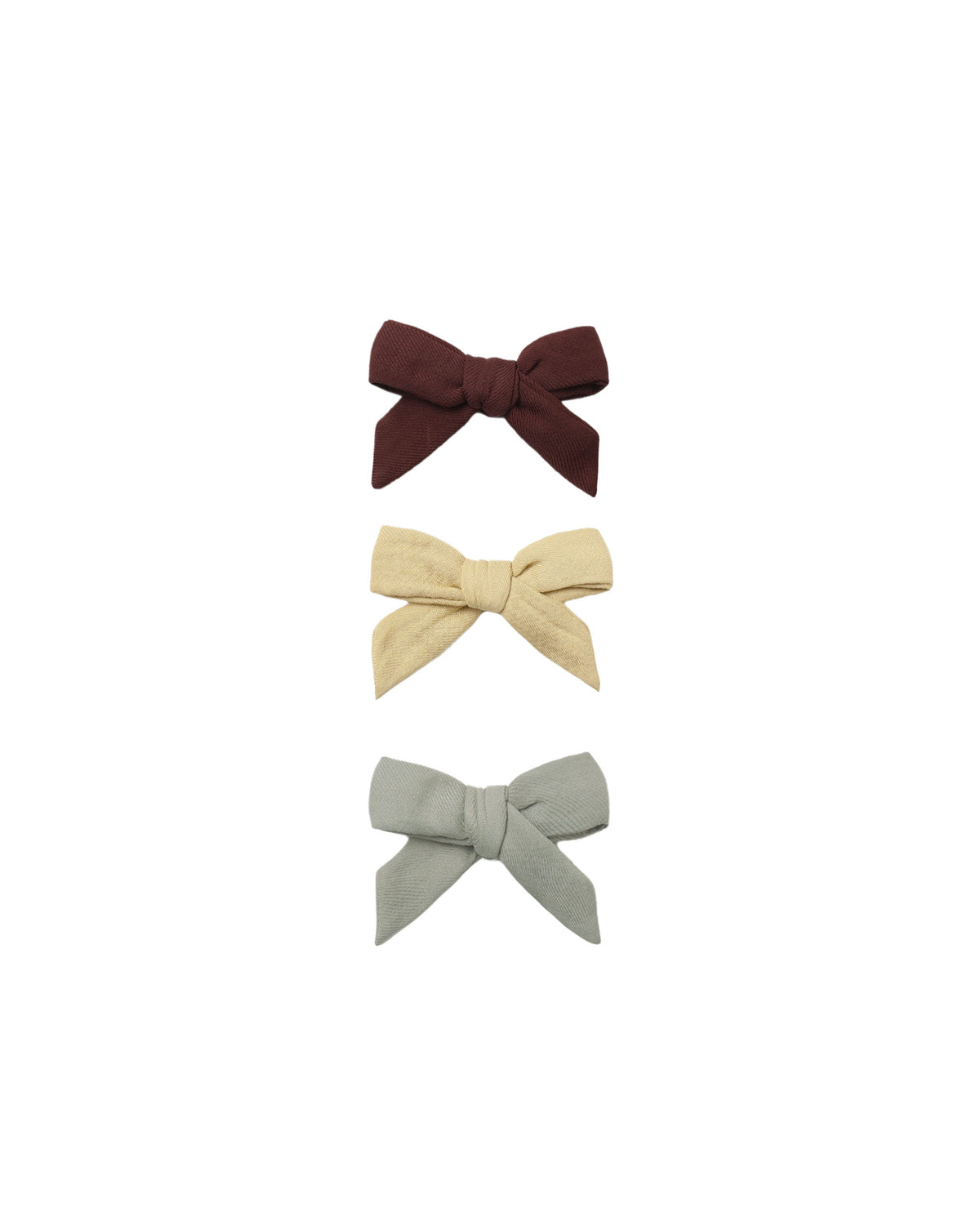 Set of three Quincy Mae bow clips in black cherry, butterscotch, and laurel colors with bow designs on a white background.