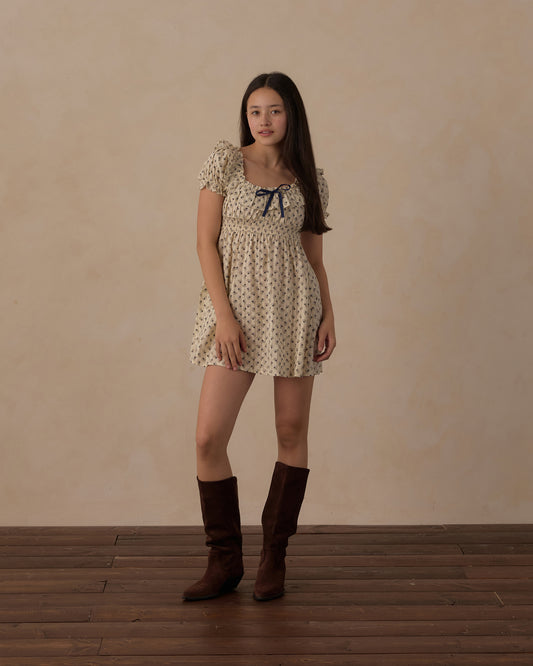 Teen vintage Fleur Dillon dress by Rylee & Cru, featuring floral print and soft fabric, displayed on a hanger against a neutral background.