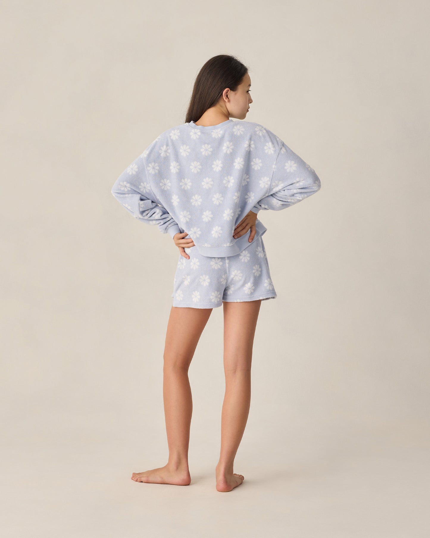 Teen periwinkle Daisy Karli set by Rylee & Cru featuring a floral print top and matching shorts in a studio setting.