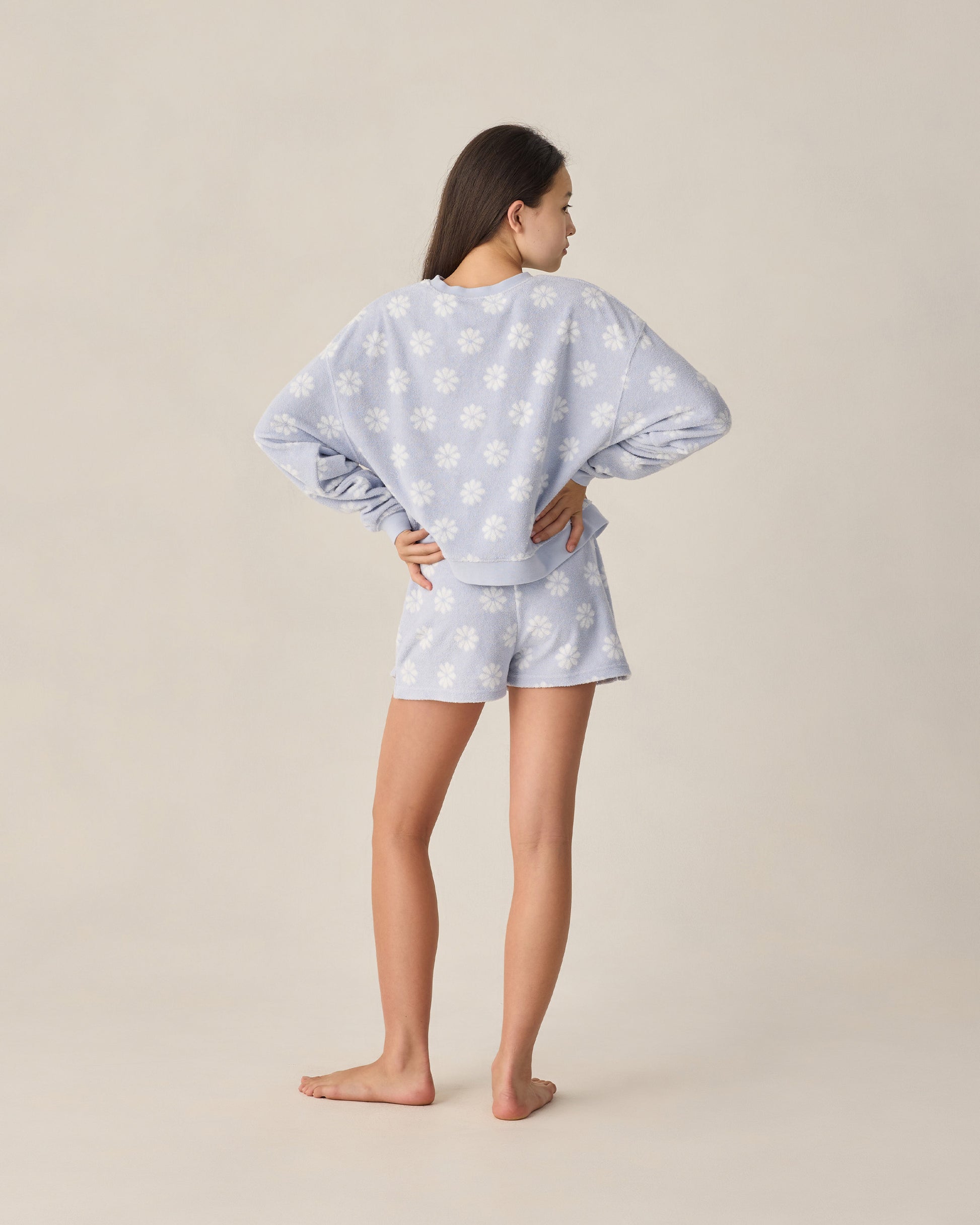 Teen periwinkle Daisy Karli set by Rylee & Cru featuring a floral print top and matching shorts in a studio setting.