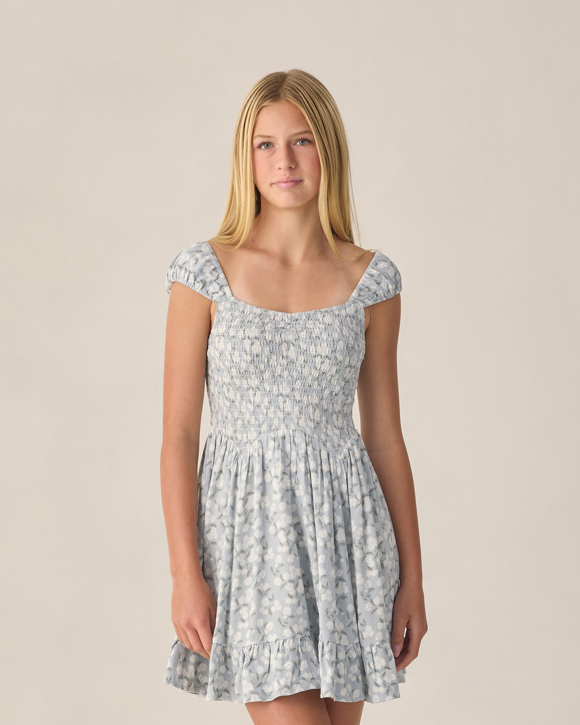 Teen Hydrangea Kalina Dress by Rylee & Cru, featuring a floral print and breezy fabric on a young girl wearing the dress.