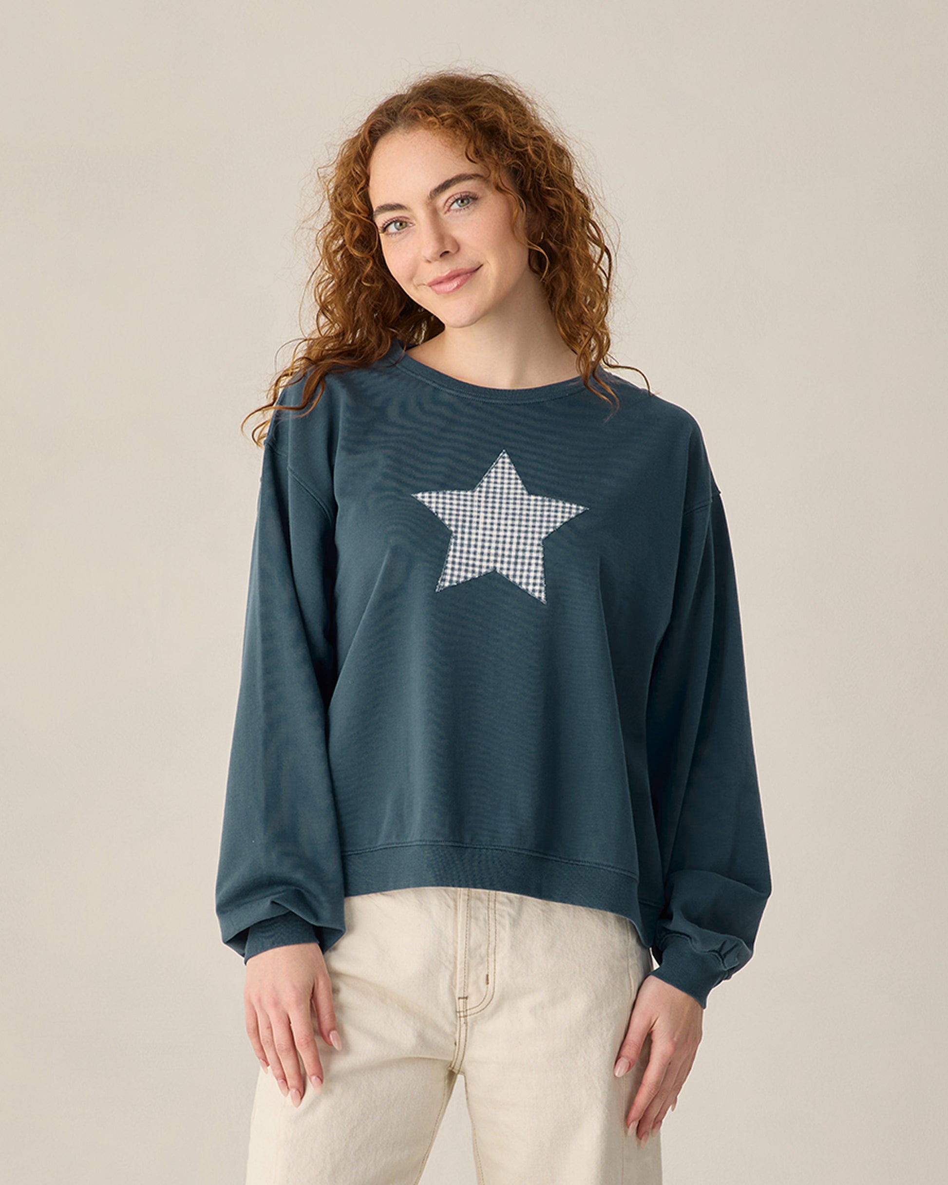 Women’s navy Pier sweatshirt by Rylee & Cru, featuring a cozy fit and casual style, shown on a model.