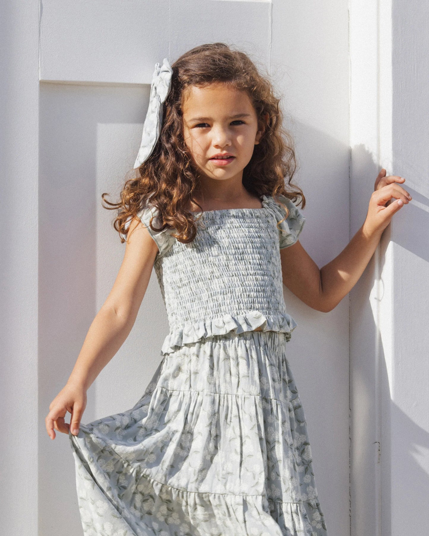 Rylee & Cru Hydrangea Zayla top in soft fabric, shown on a girl wearing the floral-patterned top in a casual lifestyle setting.