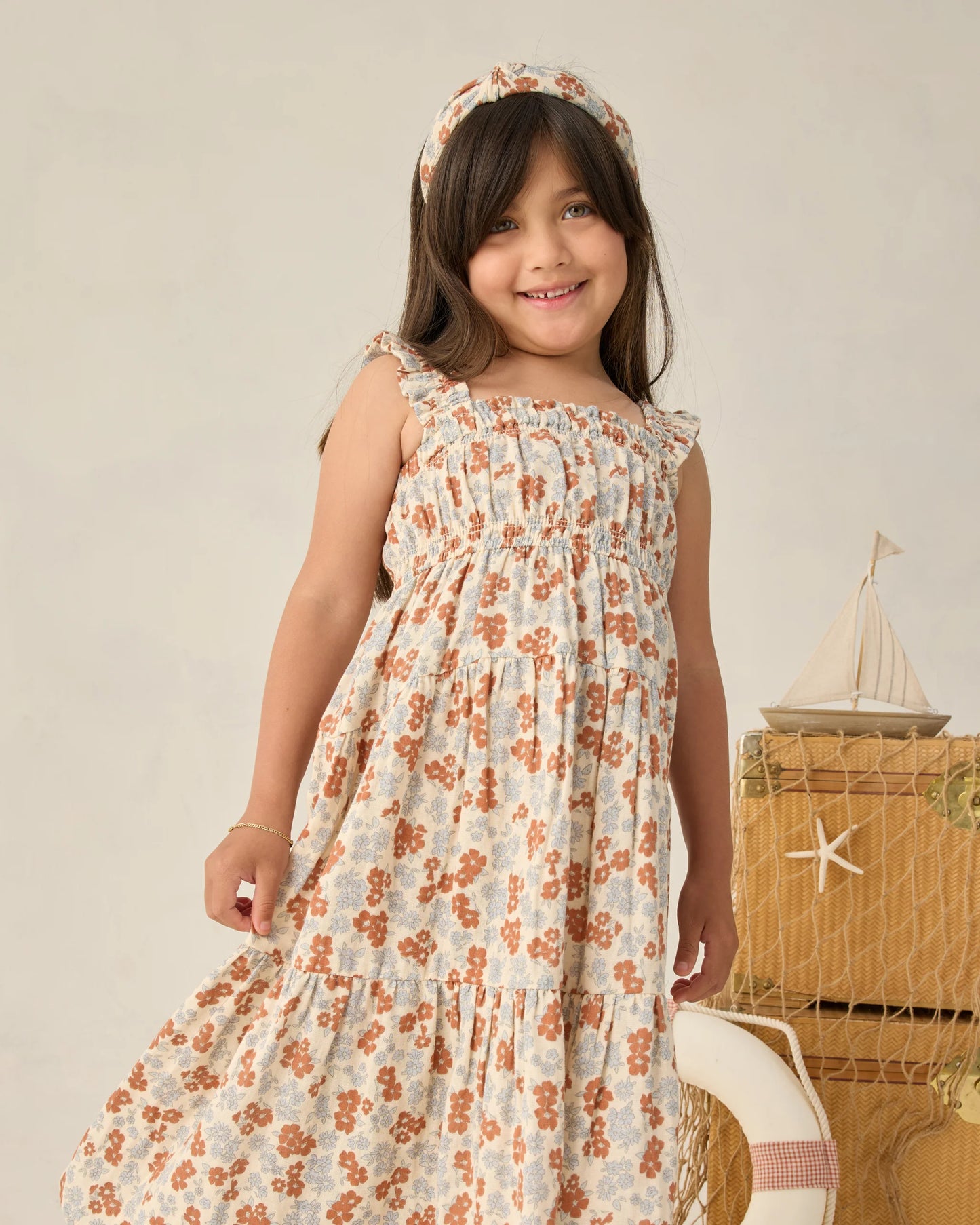 Rylee & Cru Americana Floral Josie Dress displayed on a hanger, featuring a colorful floral pattern and lightweight fabric.