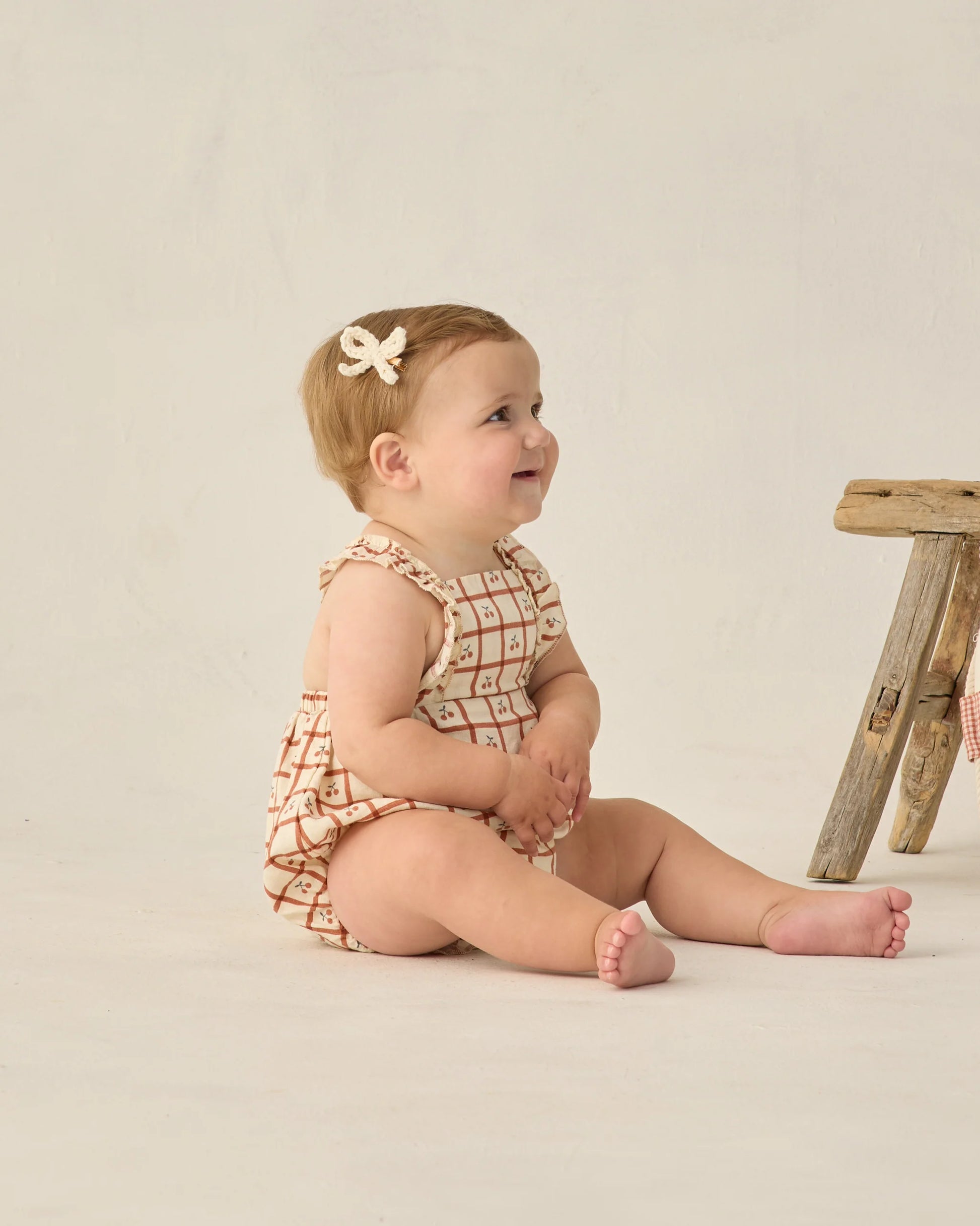 Cherry check Chiara romper by Rylee & Cru, featuring a playful cherry pattern, short sleeves, and a comfortable fit for kids.