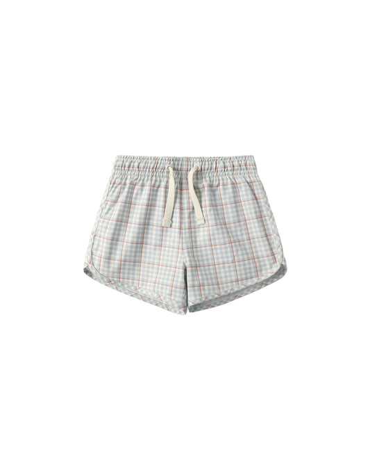 Light blue plaid swim trunks by Rylee & Cru with an elastic waistband and side pockets, perfect for beach or pool days.
