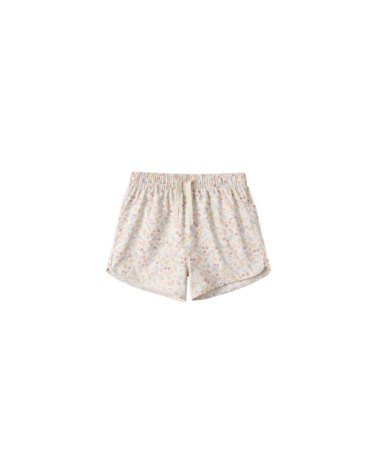 Ivory Rylee & Cru Summer Garden swim trunks with colorful floral pattern, elastic waistband, and lightweight fabric for kids' beachwear.