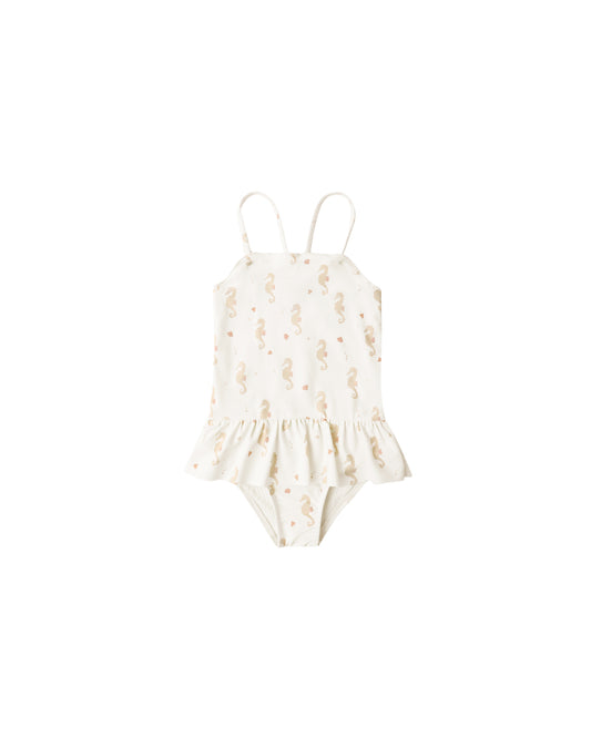 Rylee & Cru Seahorses Tori Skirted One Piece swimsuit in ivory with seahorse pattern, featuring a ruffled skirt and adjustable straps.
