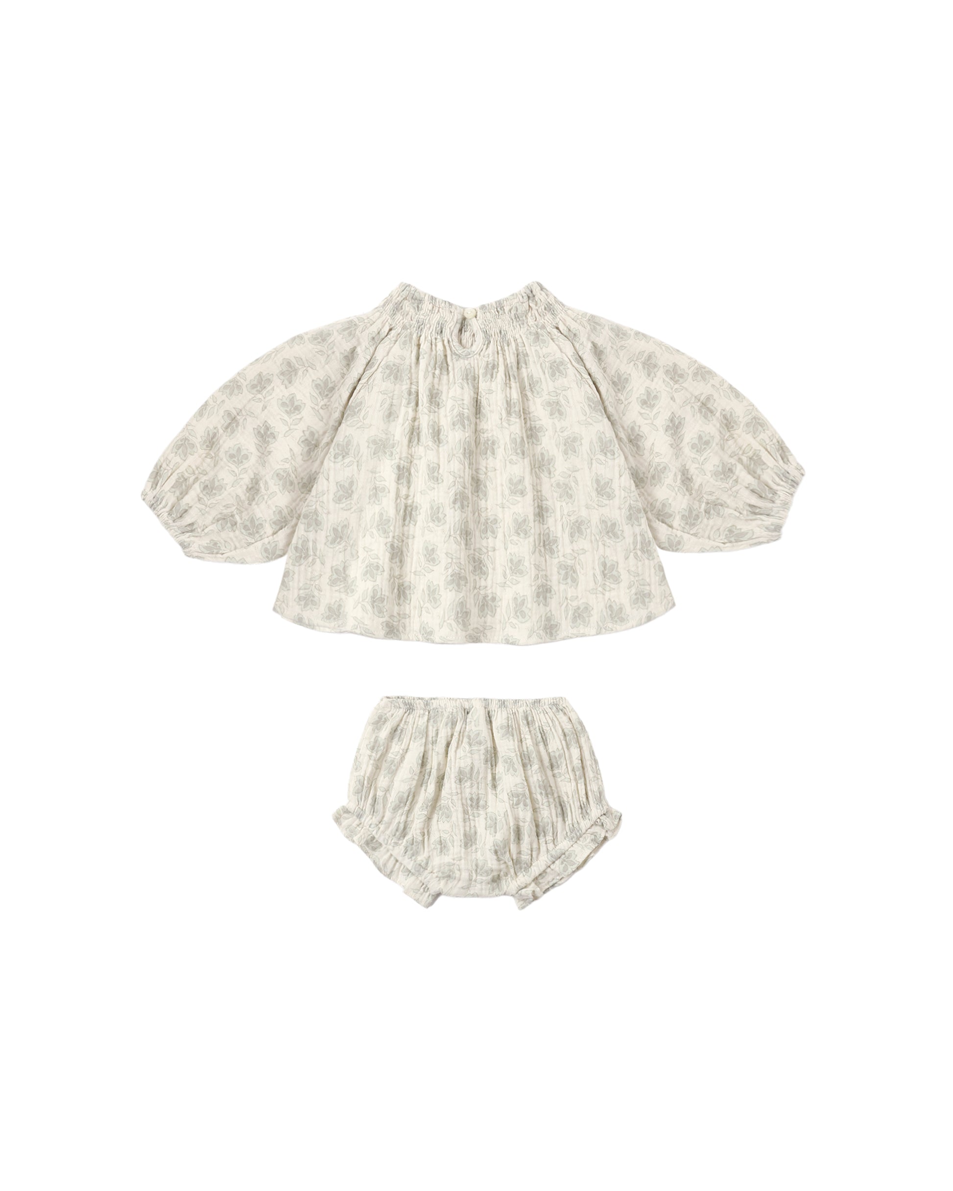 Green Iris Quincy set by Rylee & Cru featuring a natural-colored fabric with detailed stitching and charming design elements.