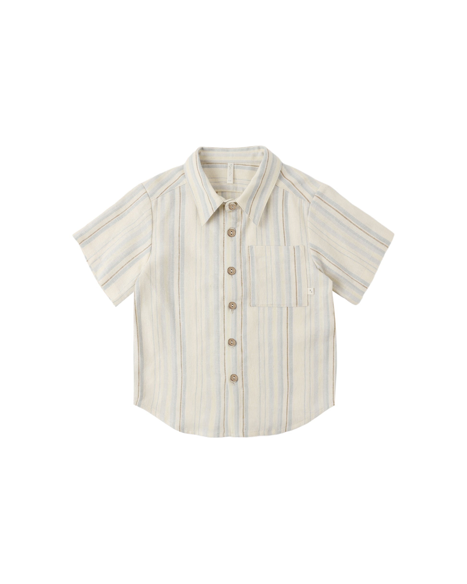 Rylee & Cru sea stripe collared short sleeve shirt in natural color displayed on a wooden surface.
