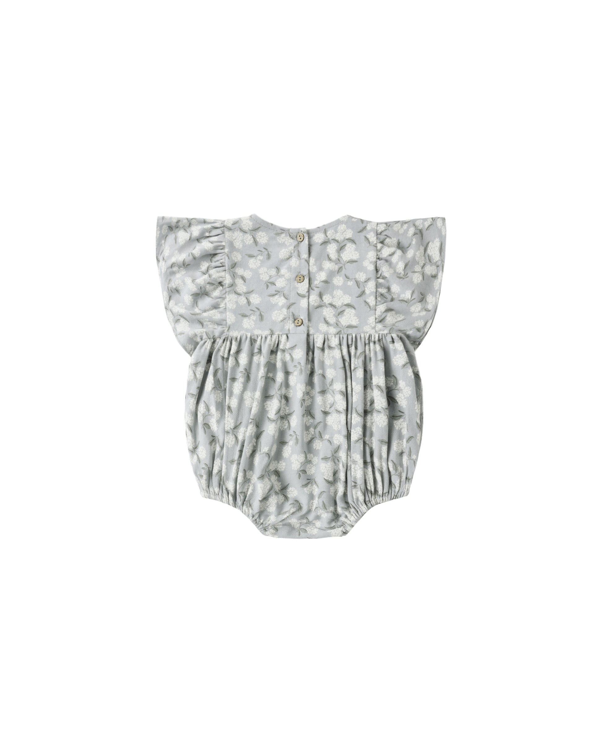 Light blue Hydrangea Kalea romper by Rylee & Cru, featuring soft fabric and a relaxed fit, displayed on a hanger.