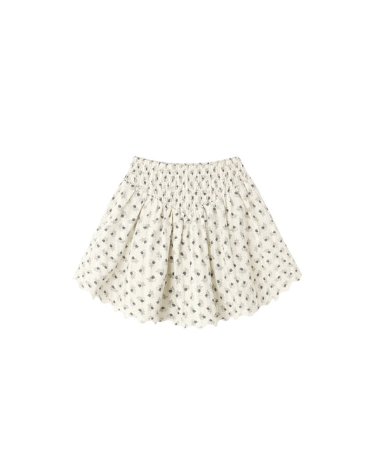 Vintage Fleur smocked V mini skirt by Rylee & Cru in natural fabric, featuring a floral pattern and smocked waistband.