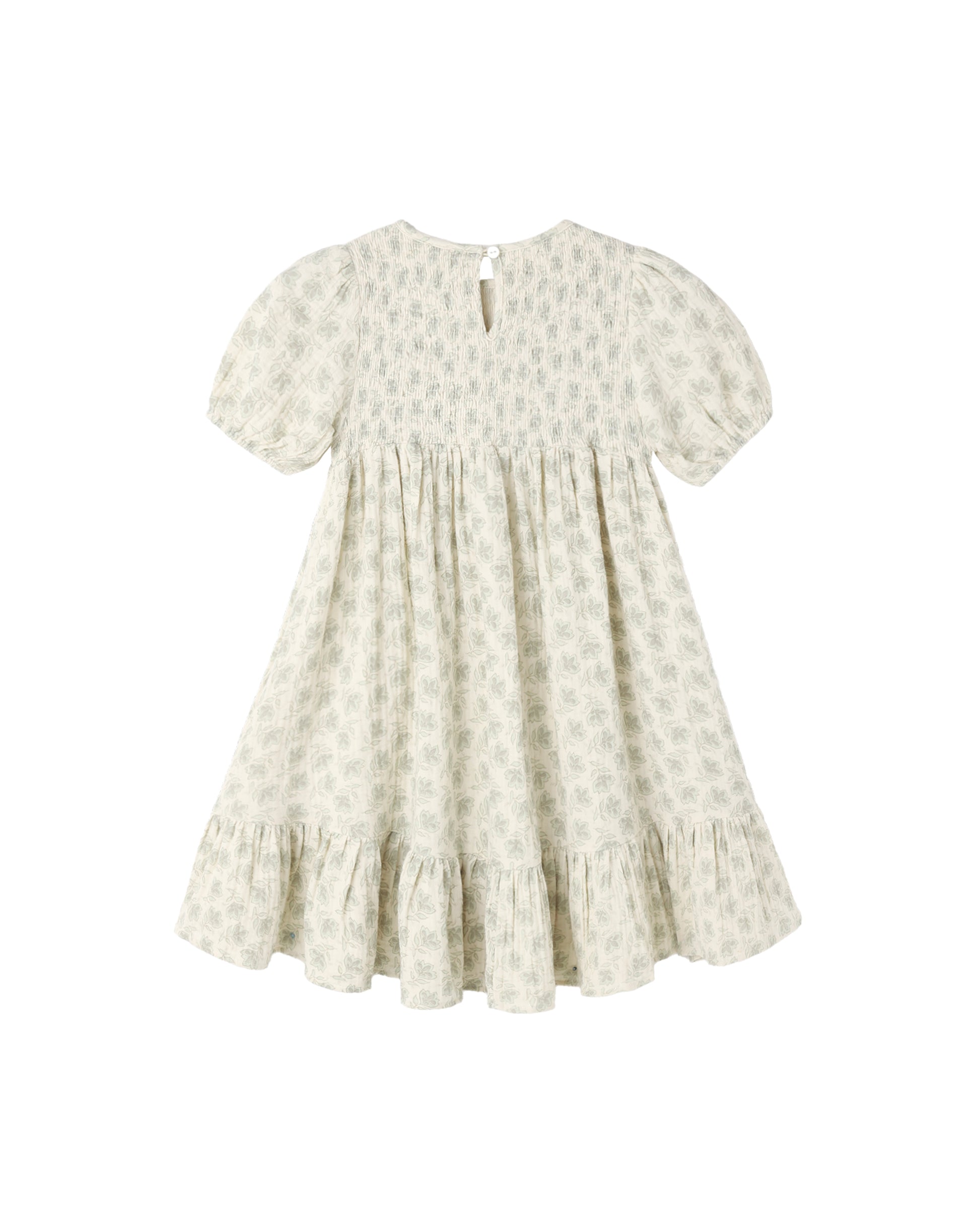 Green Iris Lydia Dress by Rylee & Cru, natural fabric with floral print, shown hanging on a wooden hanger.