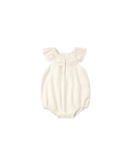 Ivory Myla romper by Rylee & Cru featuring a soft, lightweight fabric and ruffled details on a child’s playful romper.