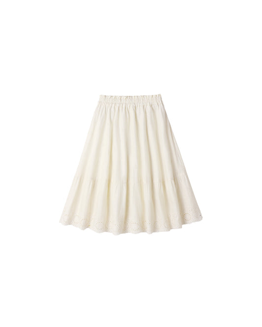 Ivory rose maxi skirt by Rylee & Cru, featuring flowing fabric and floral design, shown on a hanger against a neutral background.