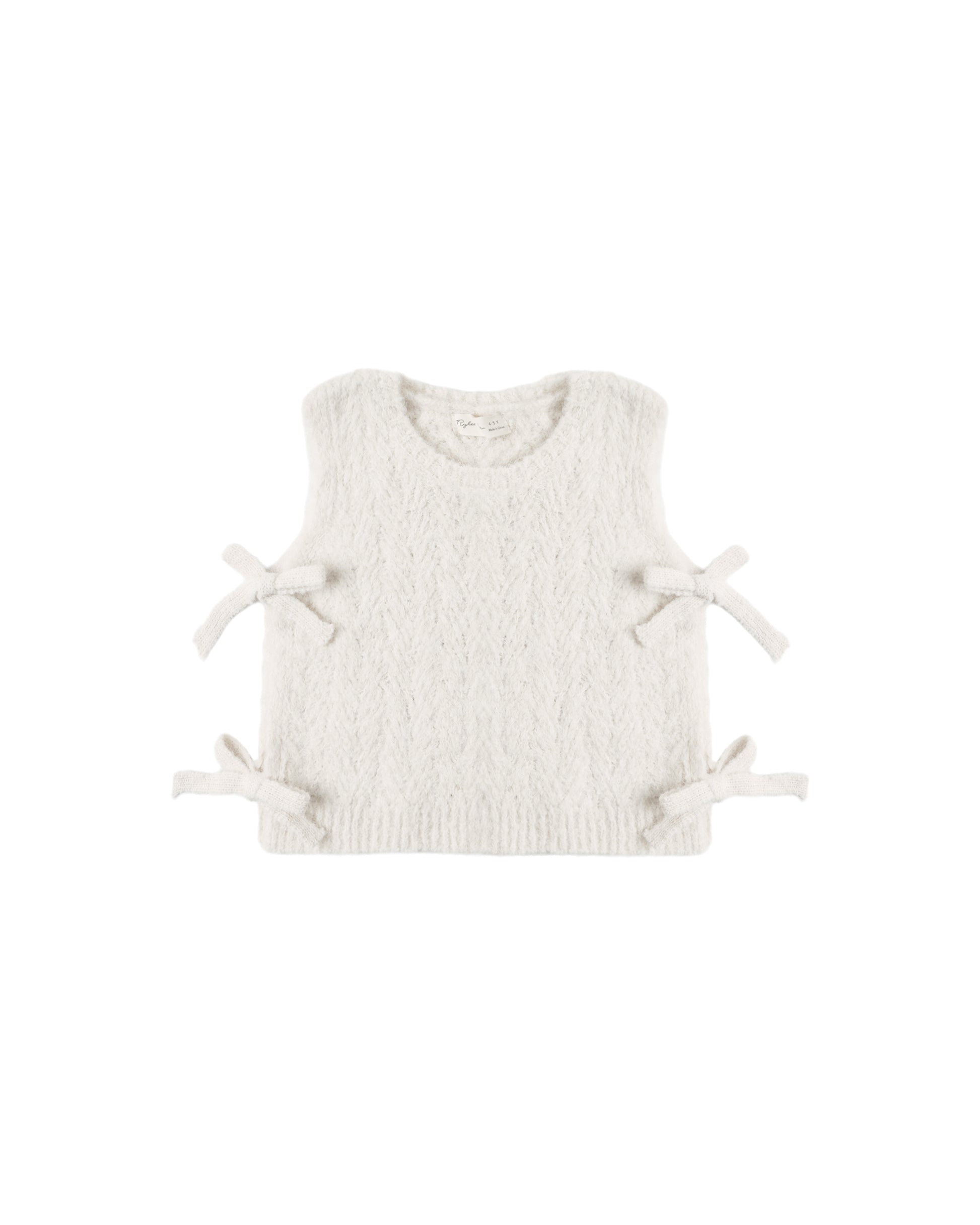 Ivory bow sweater vest by Rylee & Cru featuring a knitted design and a decorative bow at the front.