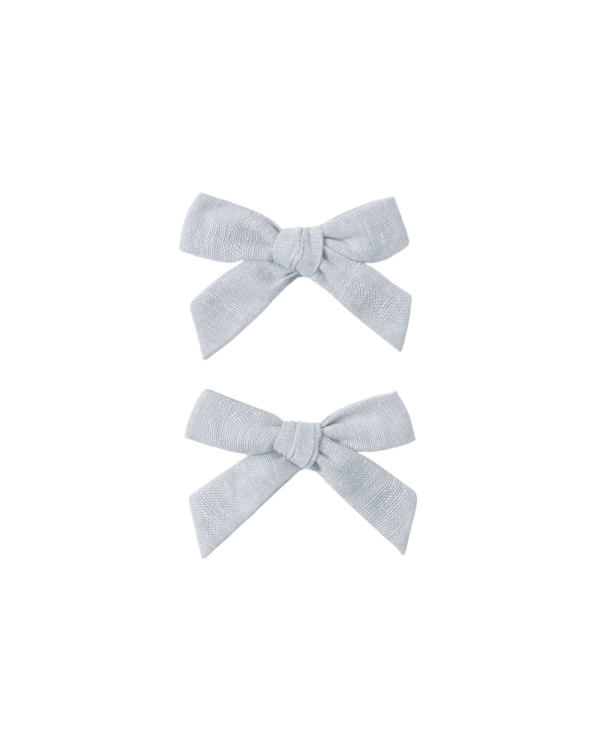 Set of two light blue heathered bows from Rylee & Cru, featuring soft fabric and a classic hair accessory design.