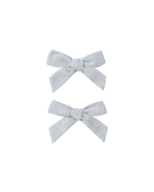 Set of two heathered light blue bows from Rylee & Cru, soft fabric hair accessories for children.