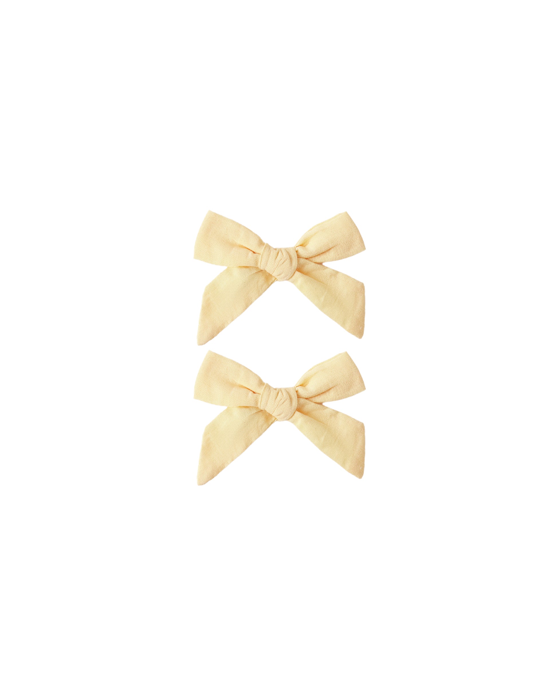 Set of two Rylee & Cru Lemon Bows featuring bright yellow lemon patterns on fabric hair accessories.