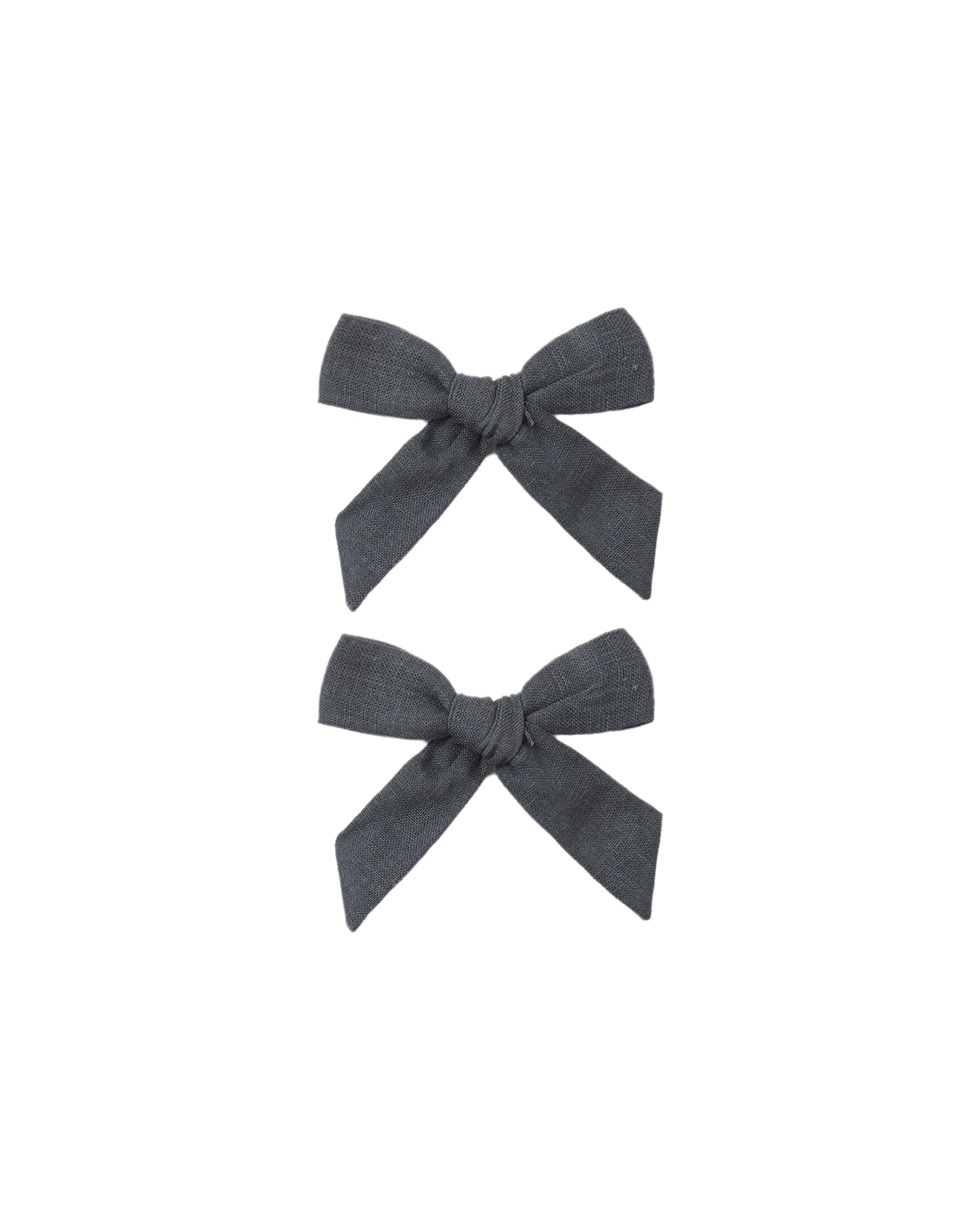 Set of two Rylee & Cru Midnight Bows for babies and toddlers, featuring soft, dark-colored fabric with cute bow designs.