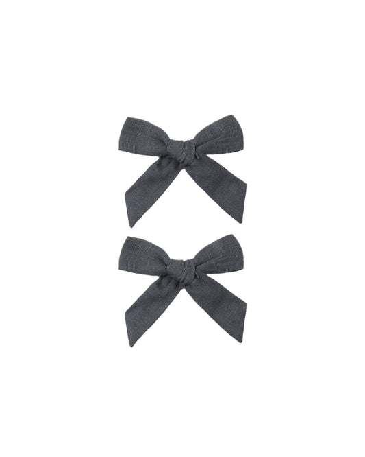 Set of two Rylee & Cru Midnight Bows for babies and toddlers, featuring soft, dark-colored fabric with cute bow designs.