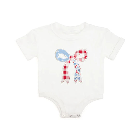 White patchwork bow patch short sleeve romper by Sweet Wink, featuring a cute design with patchwork details and a bow accent.