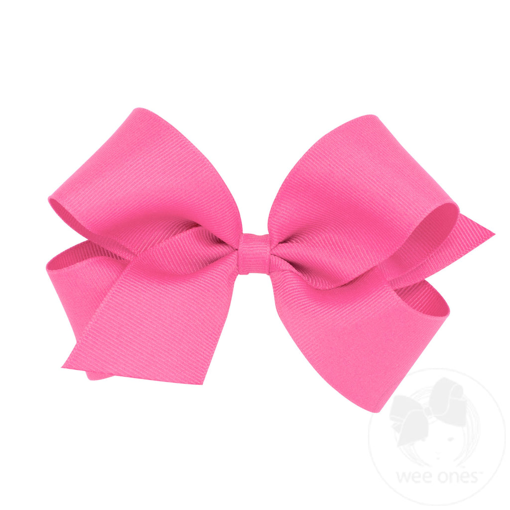 Medium classic grosgrain hair bow by Wee Ones with plain wrap, shown in a close-up view of the pink bow on a neutral background.