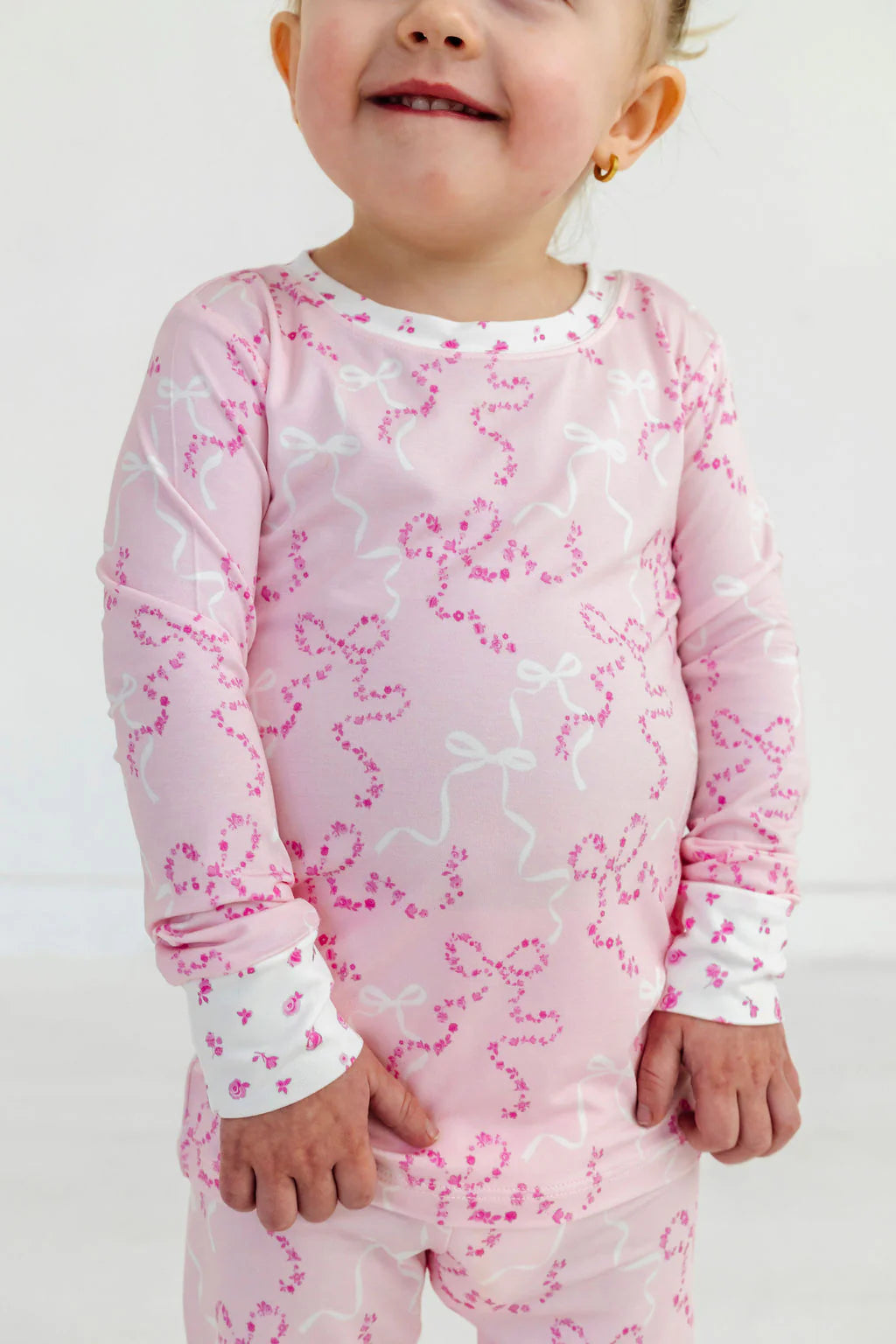 In My Jammers Cora Floral Bows two-piece set featuring a floral patterned top and matching bottoms displayed on a mannequin.