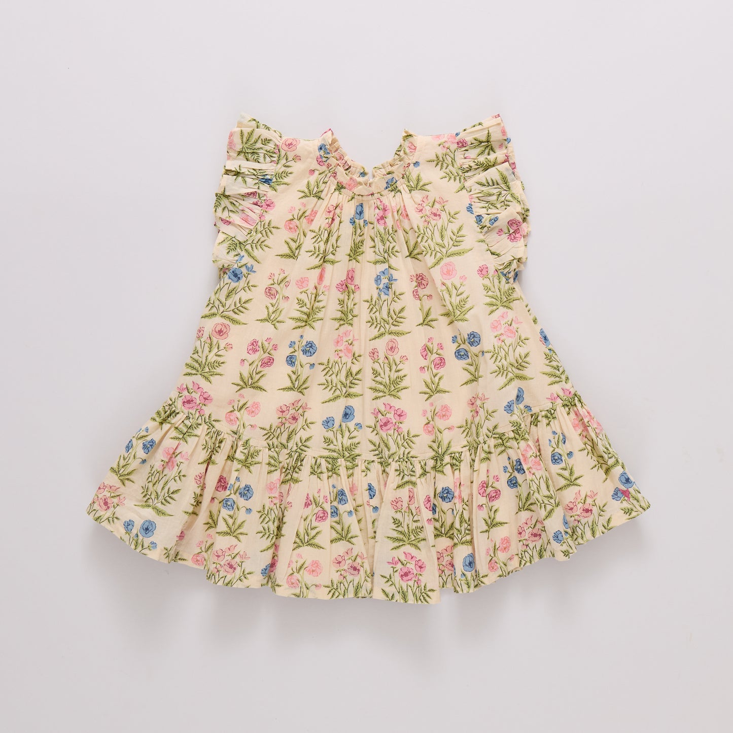 Bright pink girls' Harper dress with leafy floral pattern by Pink Chicken, featuring a ruffled neckline and sleeveless design.