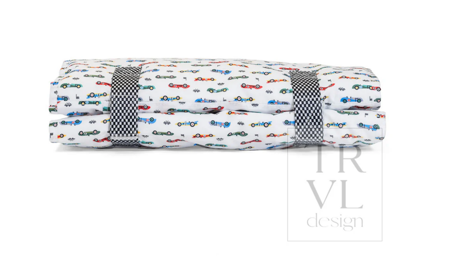 TRVL Design nap mat with colorful geometric pattern, ideal for children's naps and travel comfort.
